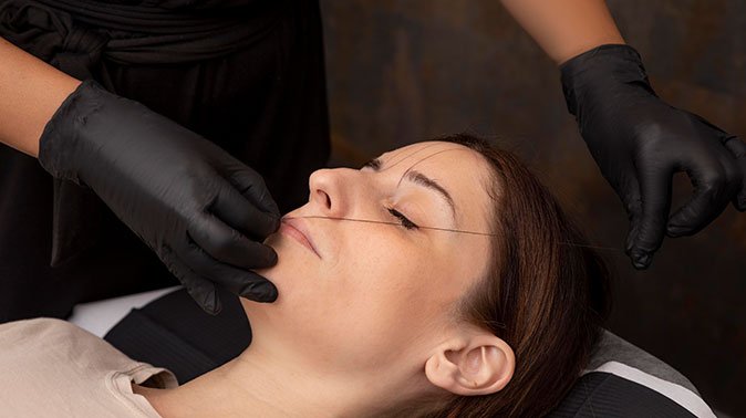 woman going through microblading procedure